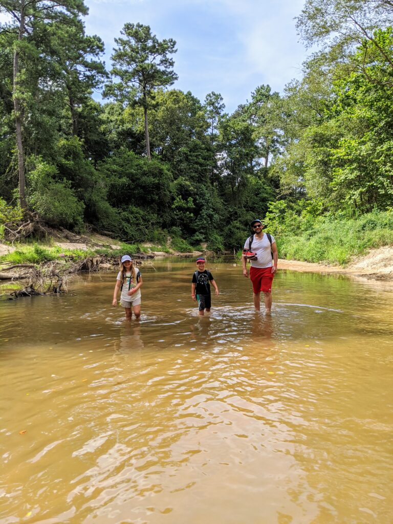 hiking with kids through a creek