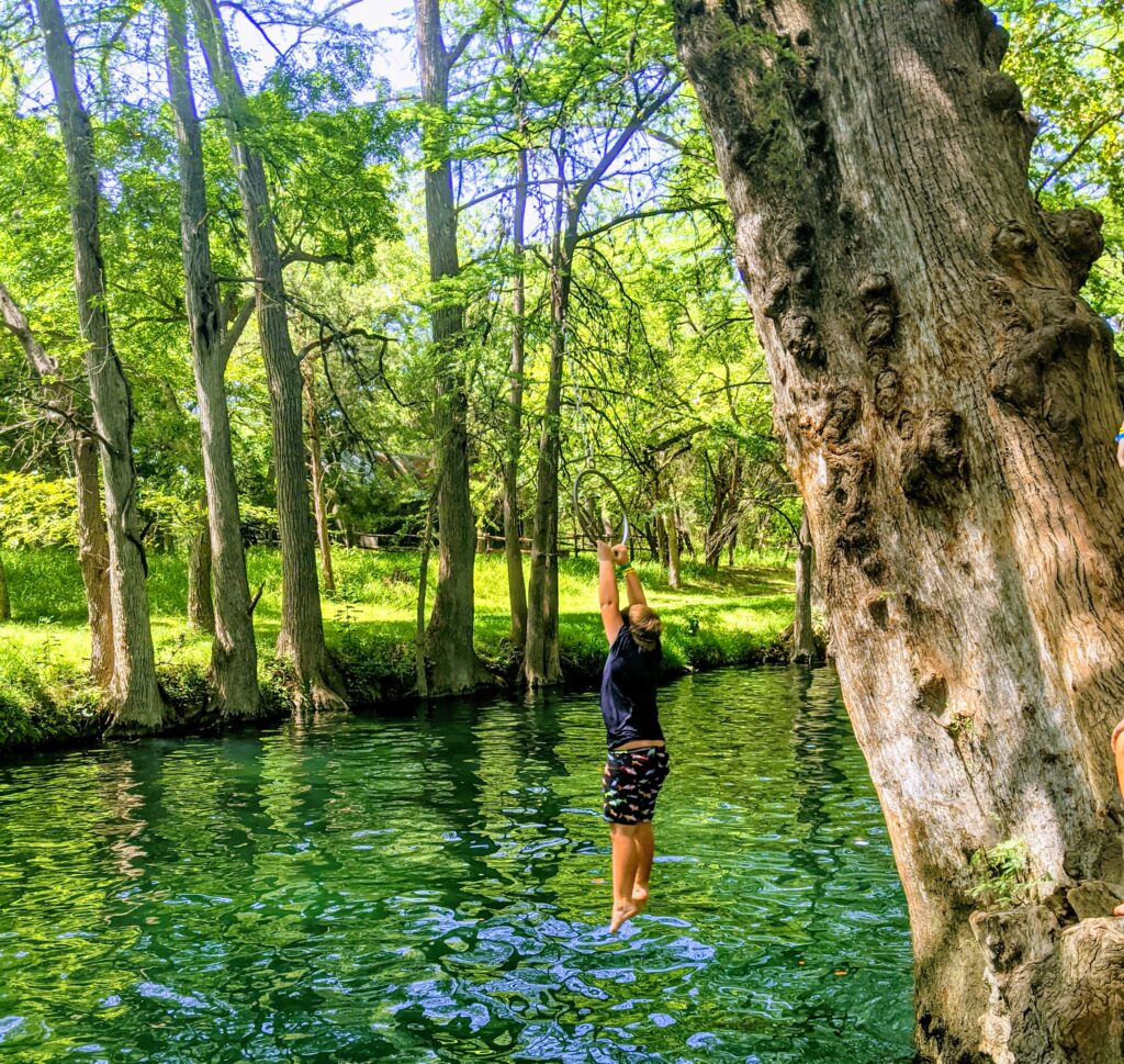 Jumping into the water at Blue Hole Regional Park